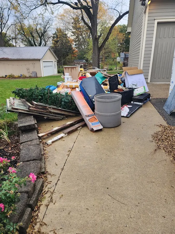 Dumpster being loaded with debris for Commercial Dumpster Rental in Coral Hills